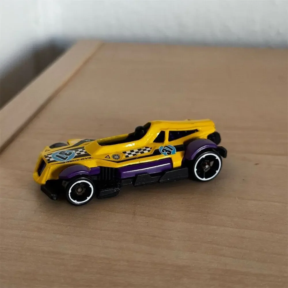 Hot Wheels Med-Evil Yellow Purple Diecast Car Mystery Models 2013 Racing Theme